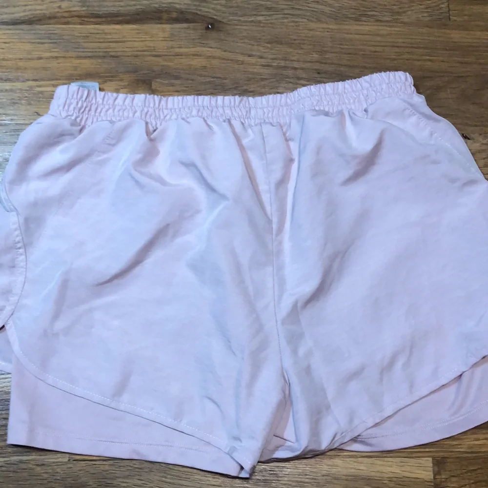 REEBOK pink performance running shorts